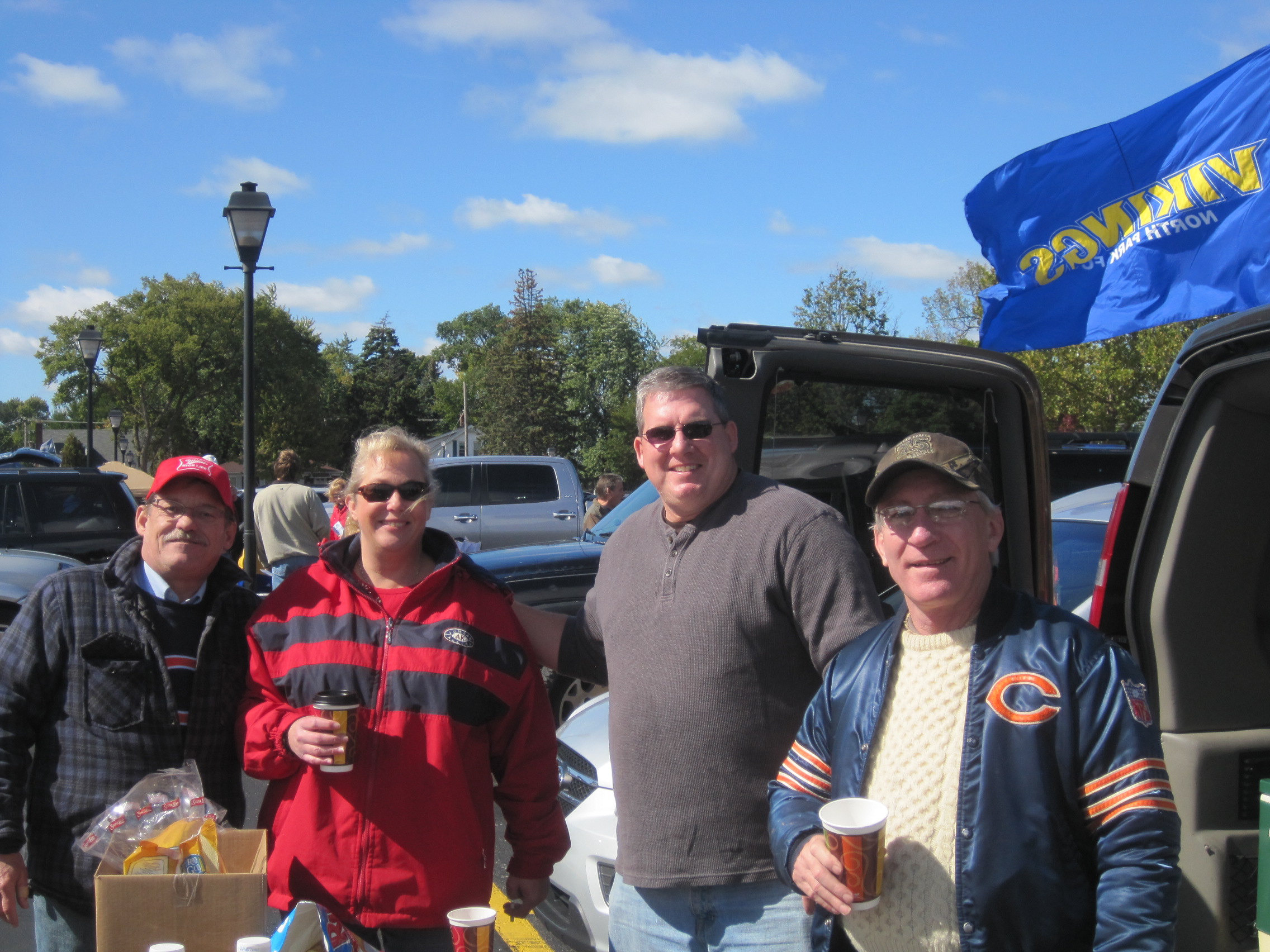 Tailgaters from North Park College, in the parking lot, they make good bratwursts