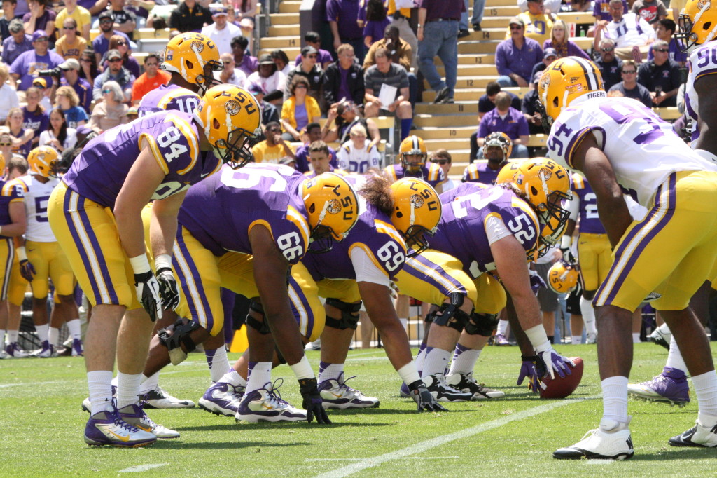 no.52 Gabe Langlois under center, ready to snap the ball.