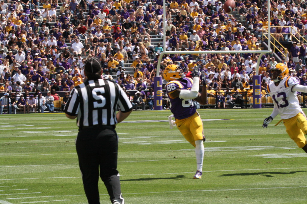 Kadrone Boone hauls in a catch for a big gain for the purple squad.