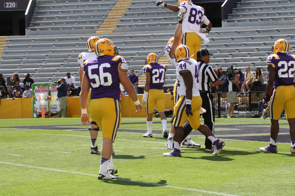 Williford lifts up Dural after a touchdown.