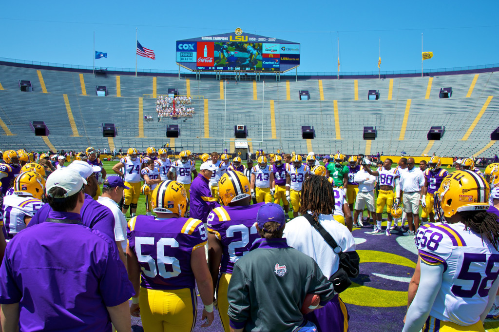 Huddling around before the spring game starts.