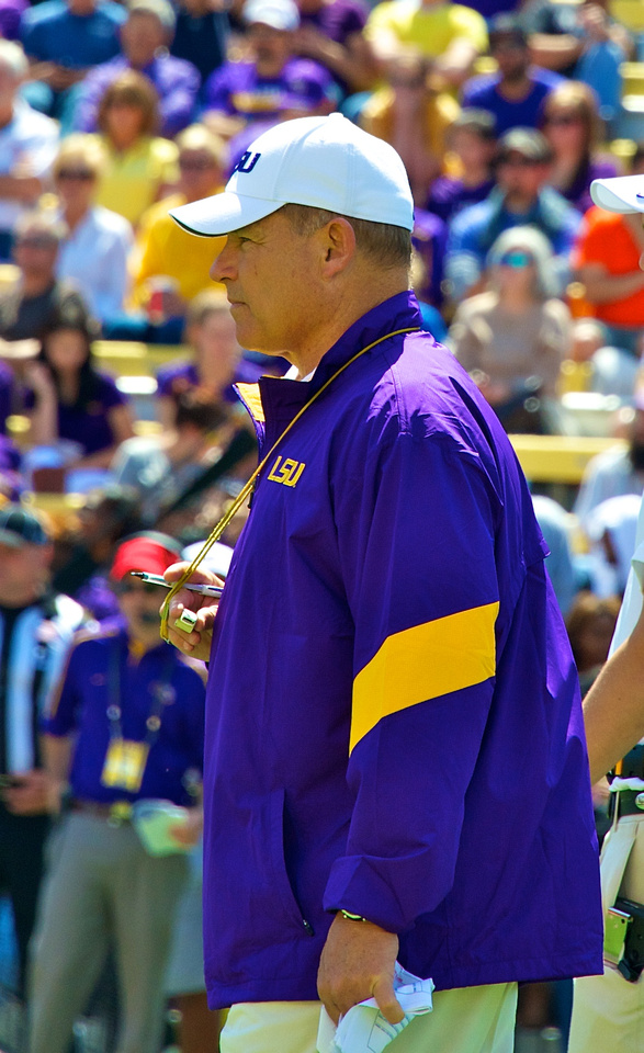Coach Miles surveys the field.