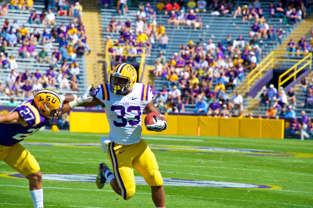 Rb Hill fends off a defender.