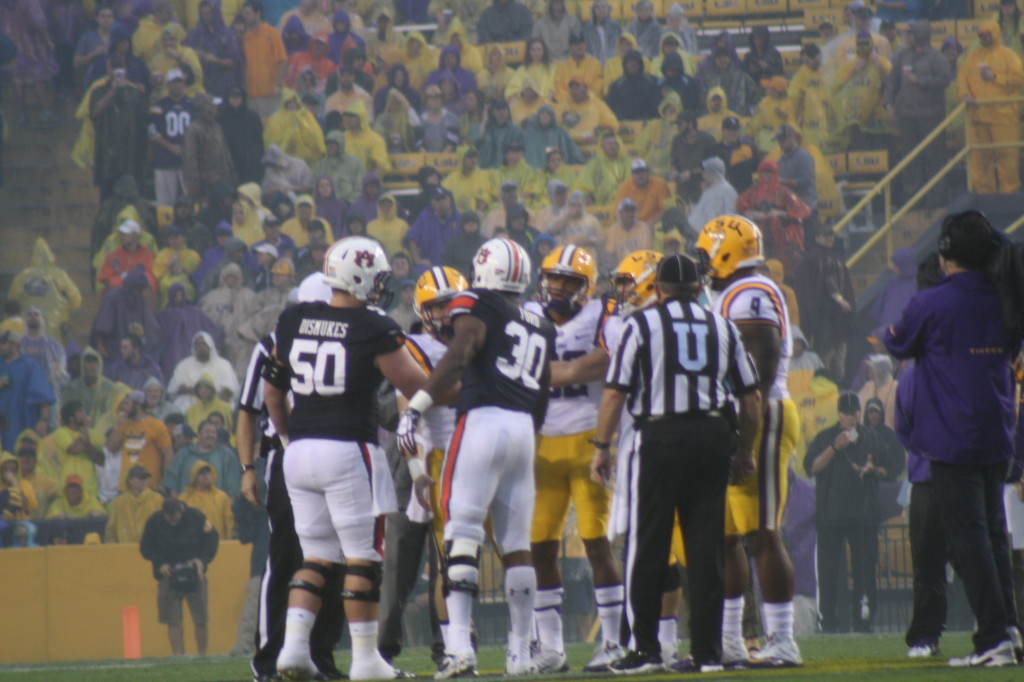The Tiger captains shake hands before the game starts.