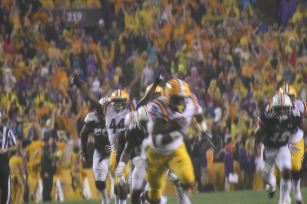 Jeremy Hill off to the races as J.C. Copeland celebrates in the back ground.