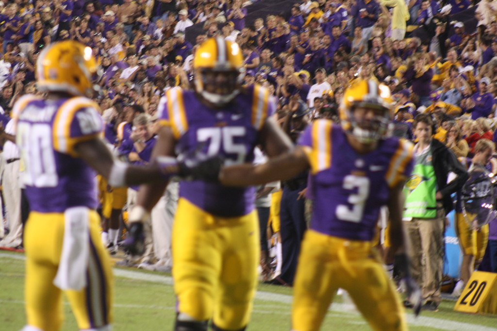 Jarvis Landry slaps hands with Beckham Jr after a TD.