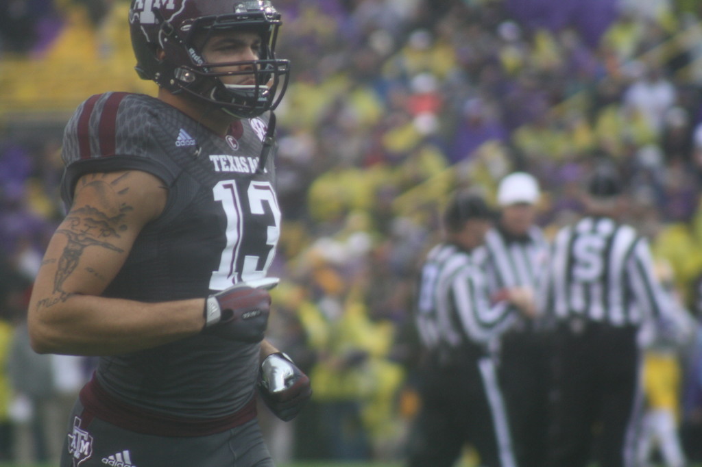 no.13 Evans running over to the sidelines