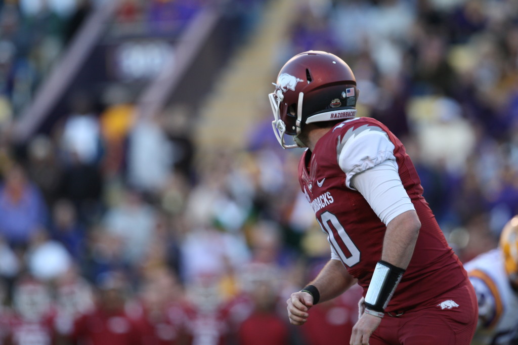 Arkansas QB Brandon Allen looks downfield as the throws a pass.