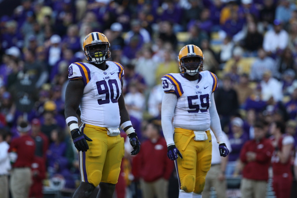 no.90 Anthony Johnson and no.59 Jermauria Rasco looks to the sidelines for some direction from the coaches.