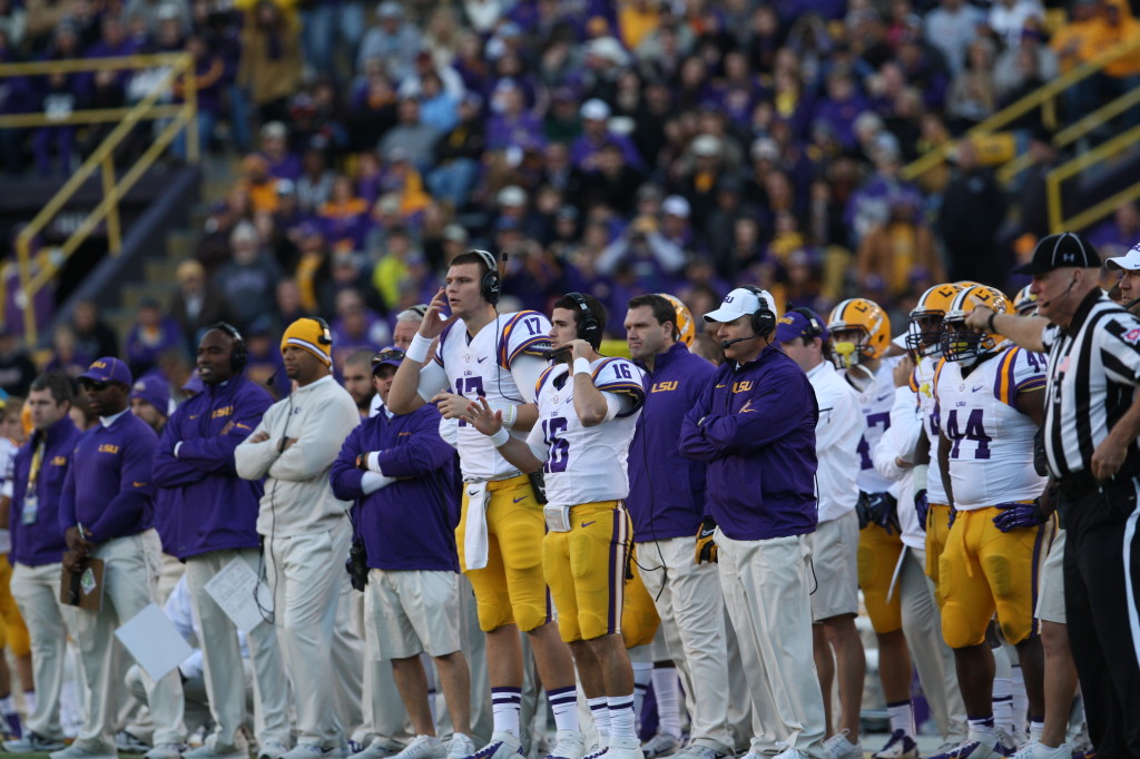 LSU sidelines looking on.