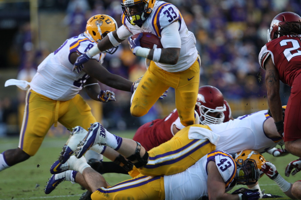 LSU RB Jeremy Hill goes airborne against Arkansas Defense.
