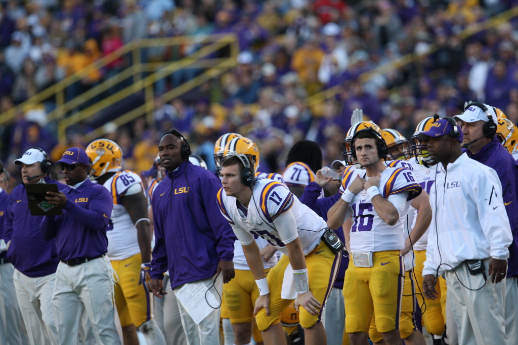LSU sidelines looking on.
