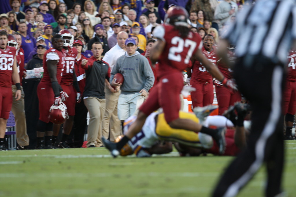 no.80 Landry rolls over a wrestles the ball from the Arkansas DB.