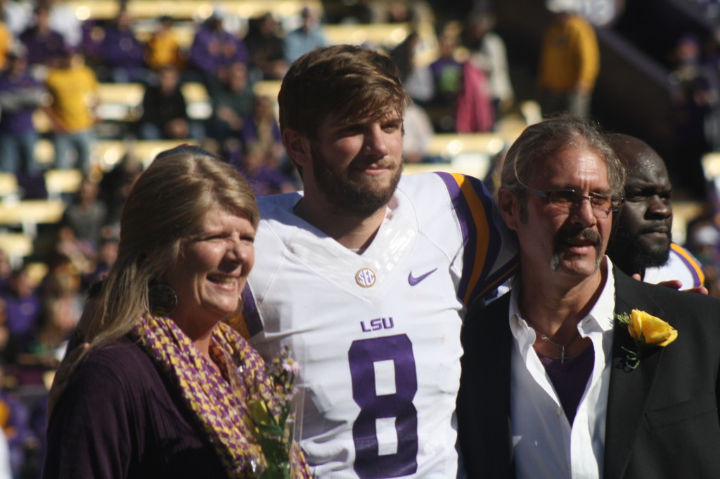 Zach Mettenberger is with his parents on senior day.