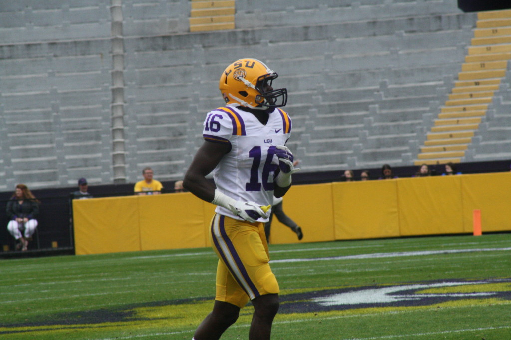 Tre White jogging back to the huddle