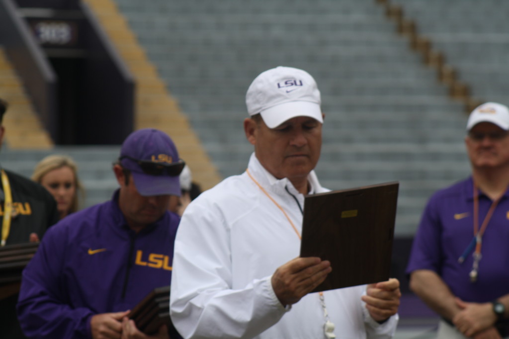 Coach Miles handing out awards.