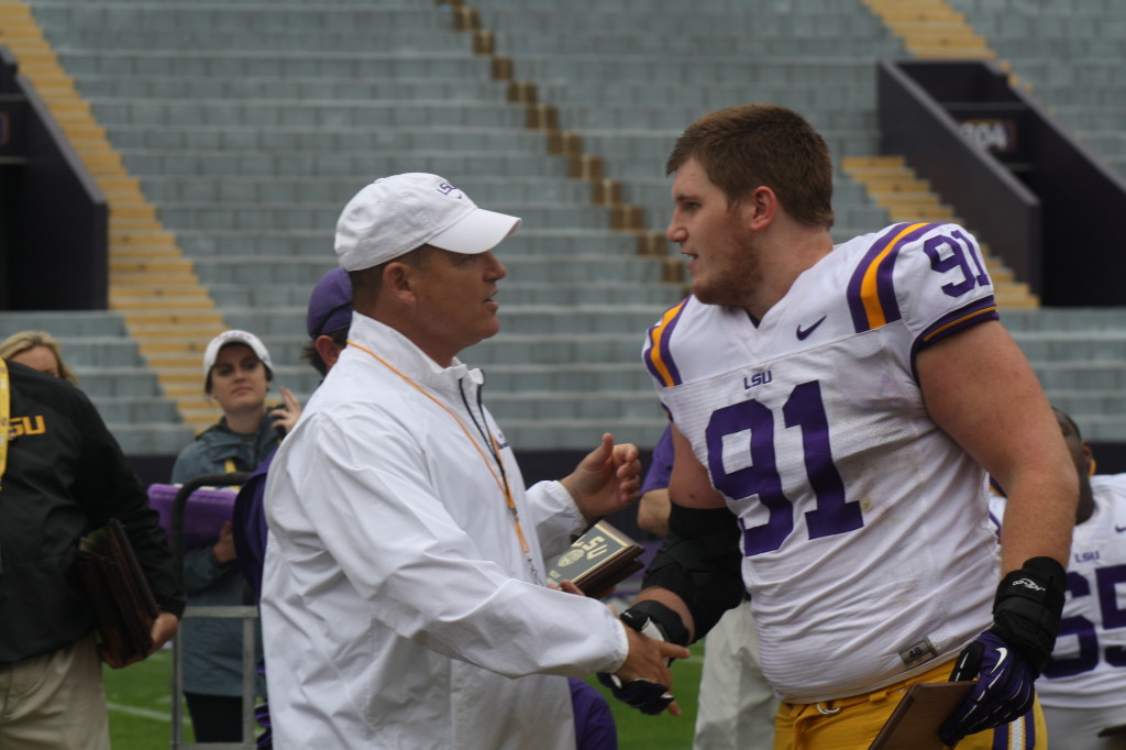 Coach Miles gives a award to 91 Christian LaCouture