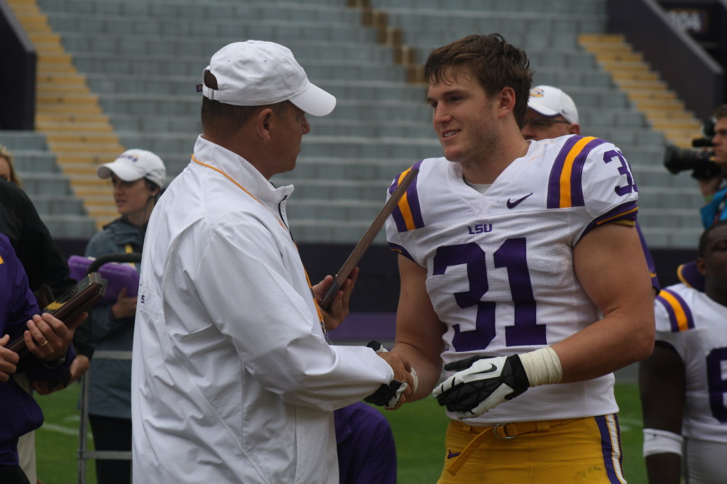 Coaches Miles gives a award to DJ Welter