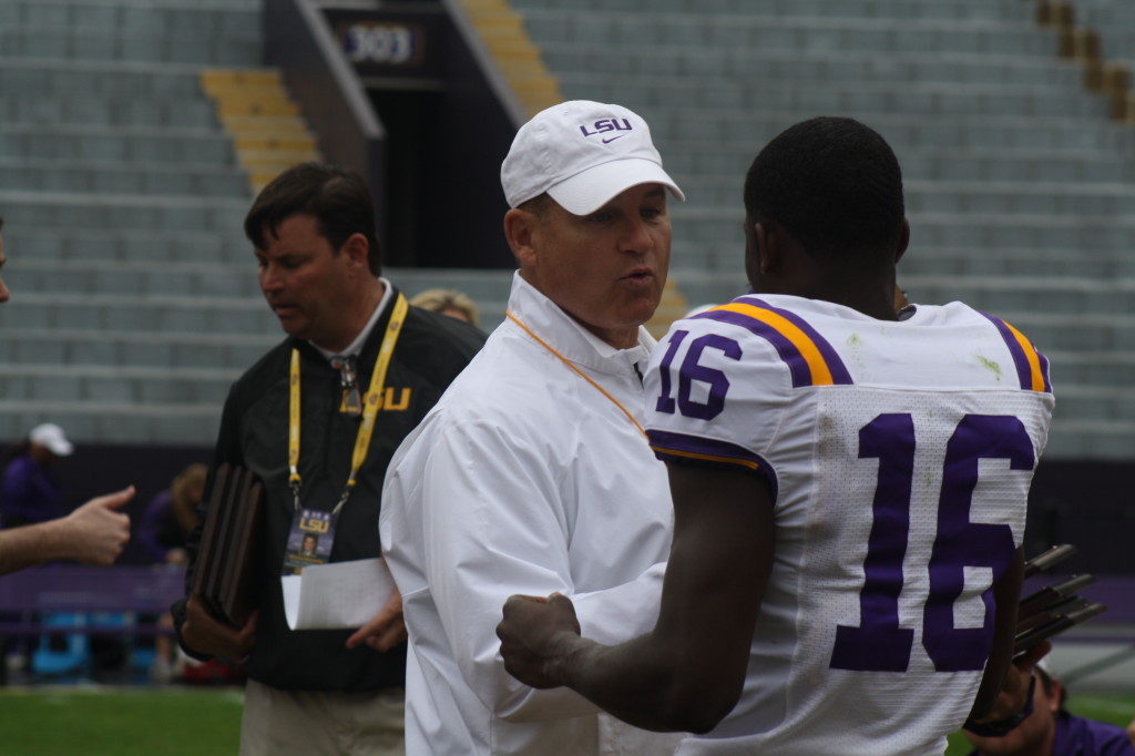 Coaches Miles gives a award to Tre White