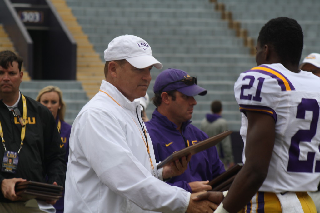 Coaches Miles gives a award to Rashard Robinson