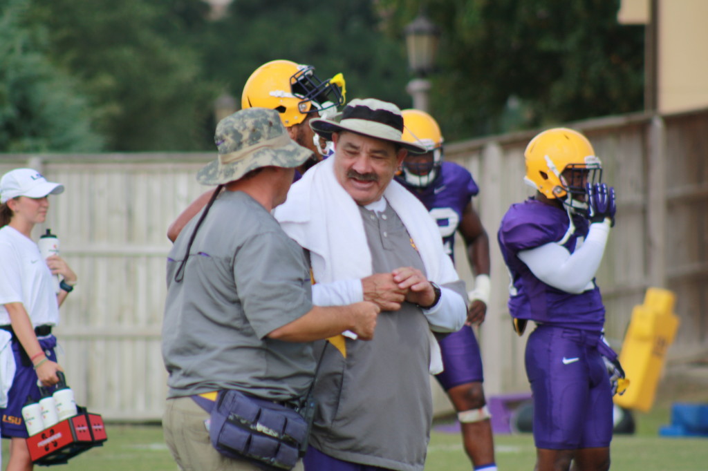 Defense Coach Chavis having a chat during the summer practice