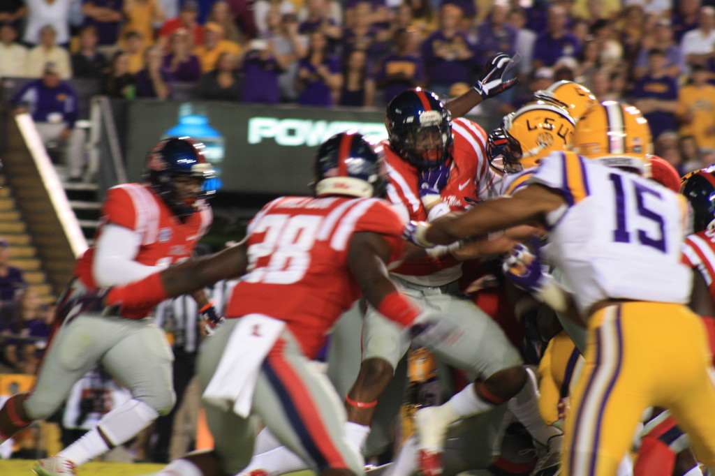 LSU Fournette runs into the Ole Miss Defense.....