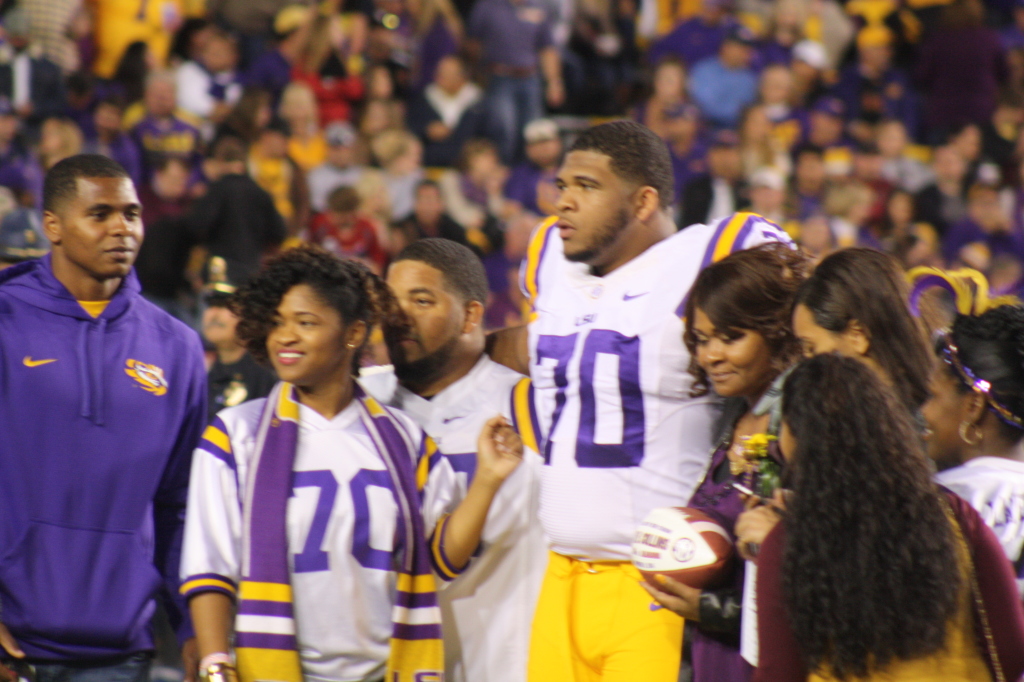 LSU La'el Collins taking a picture with his family