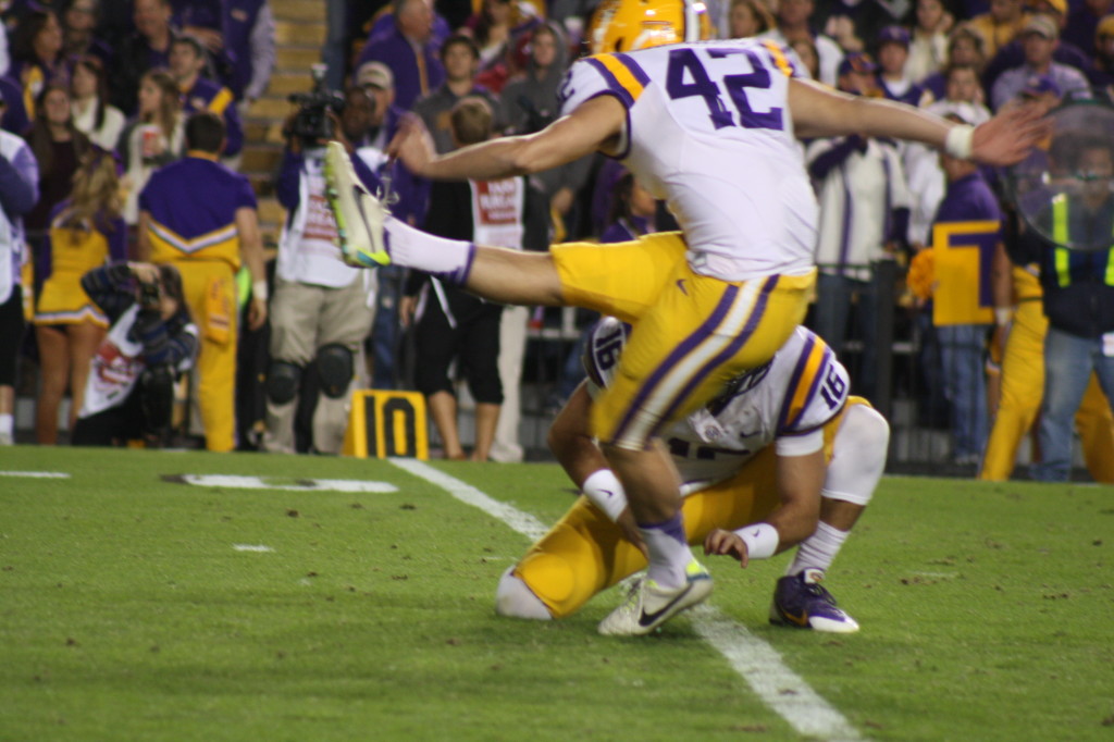 LSU Delahoussaye kicks a extra point thru