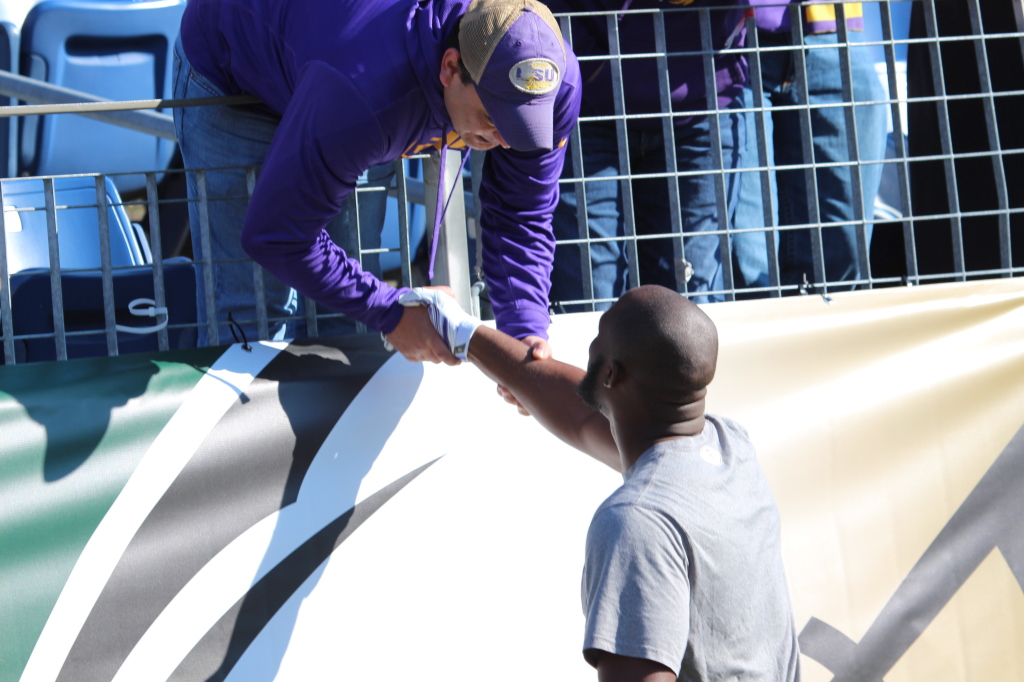 LSU Fournette says hello to a LSU Fan at the Music City Bowl.