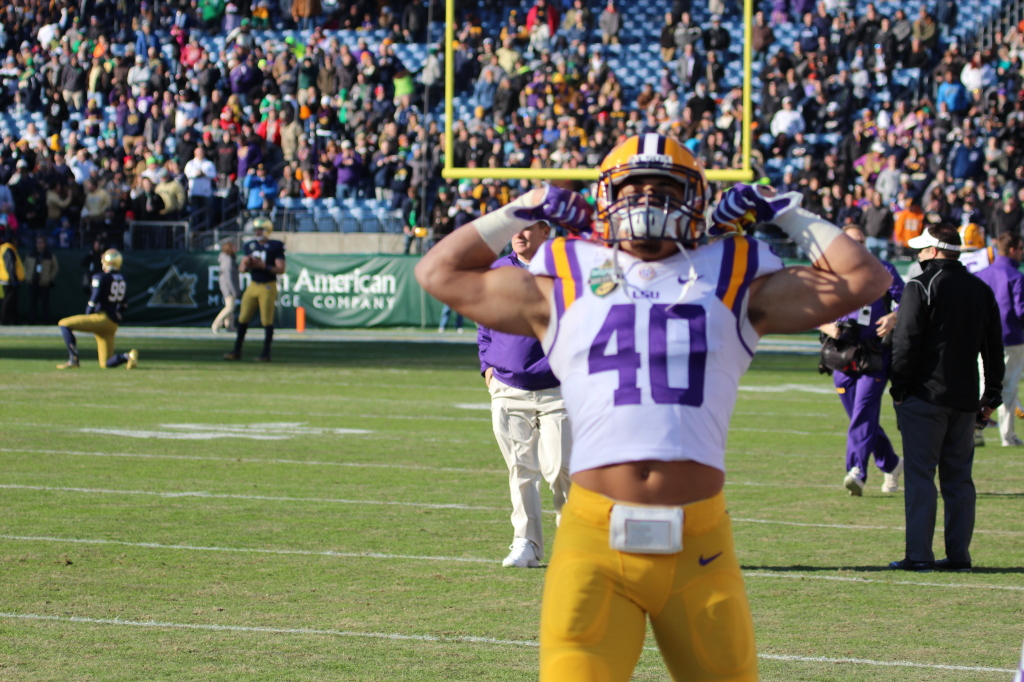 LSU Duke Riley flexes his muscles before the Notre Dame Game....