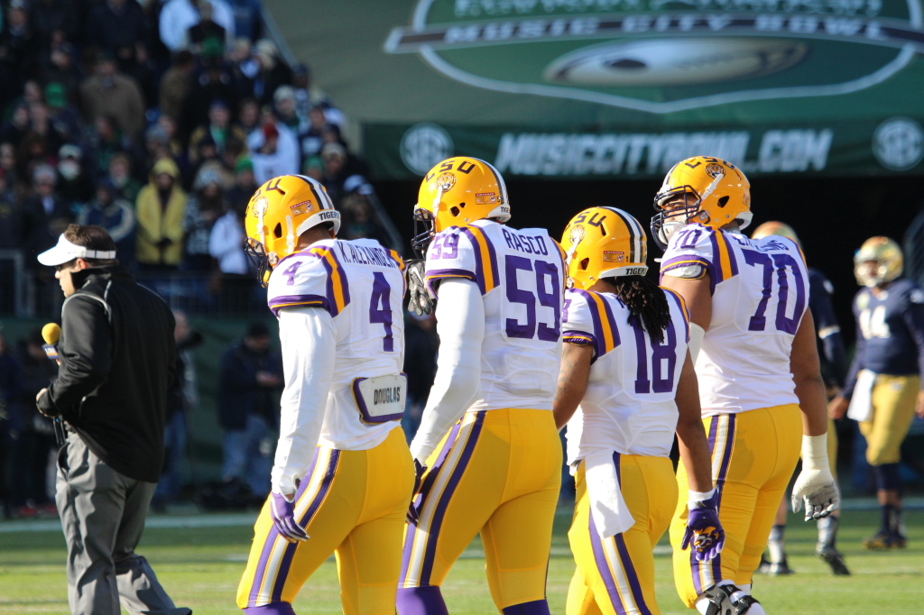 LSU Team Captains going to mid field for the coin toss. 