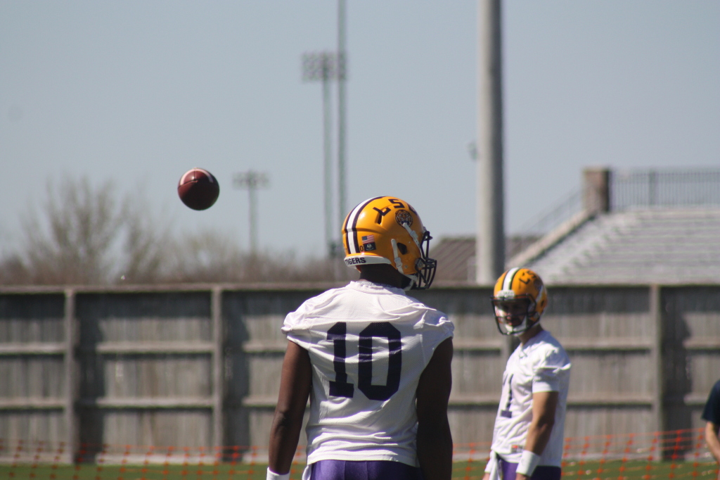 QB Jenning looking on as backup qb Harris zips a pass by.