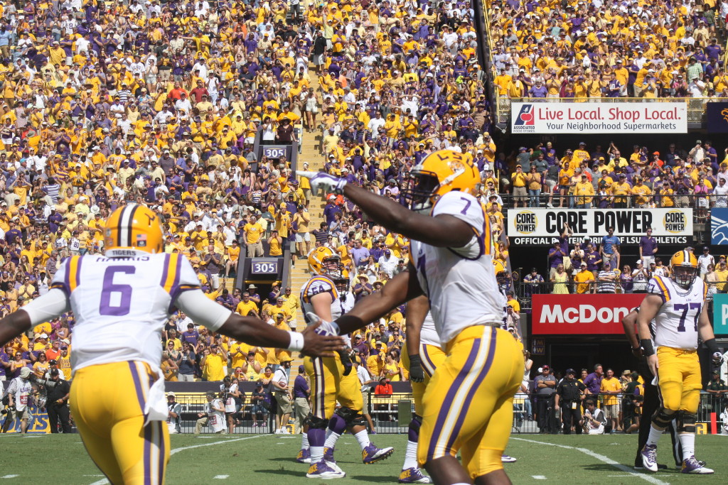 Fournette gets a congrats from LSU qb Harris after his long run.