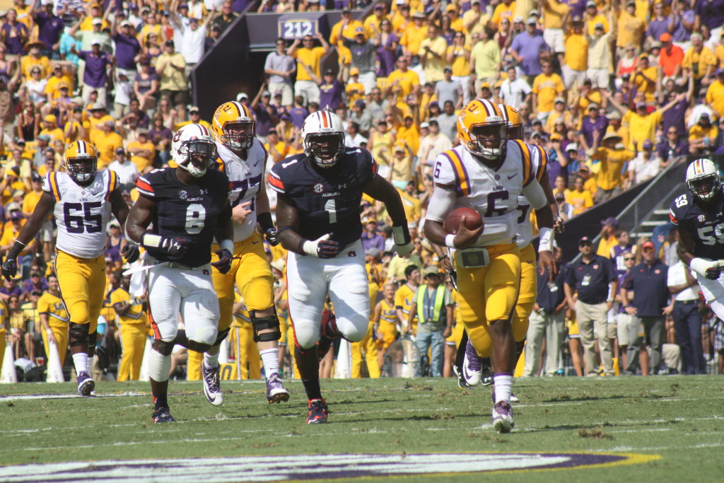 LSU QB Brandon Harris breaks from the pack.