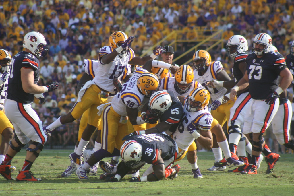 The LSU D wraps up Auburn rb Barber.