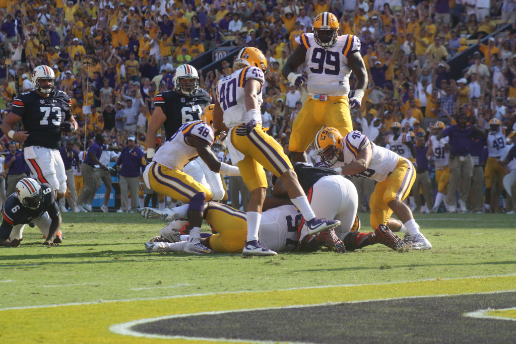 LSU Gilmore no.99 jumps for joy as LSU recovers the fumble inside the 10 yard line.