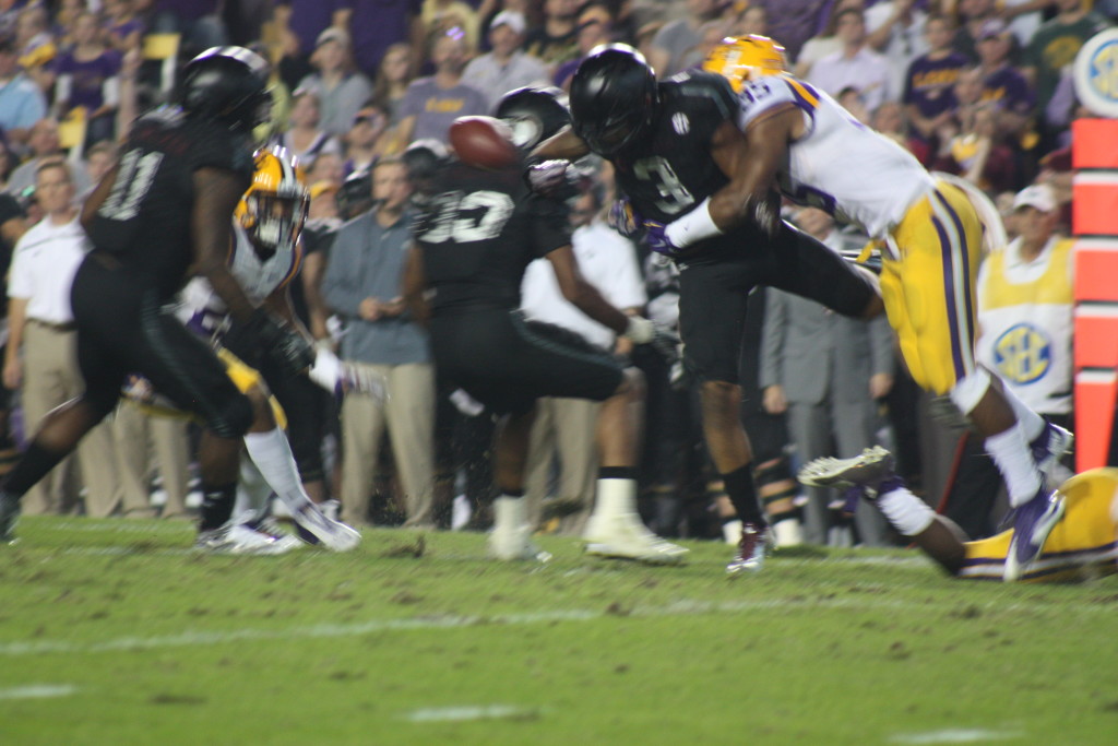 LSU Deion Jones hits AM kick returner as he jars the ball loose.