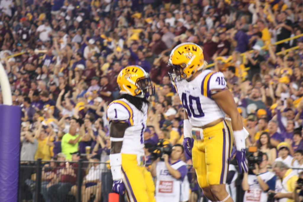 Duke Riley celebrates with Donte Jackson.