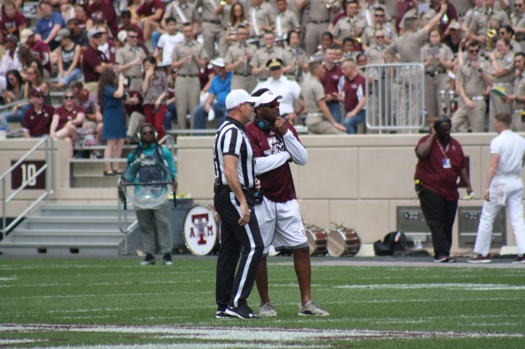 Coach Sumlin having a talk with the ref.