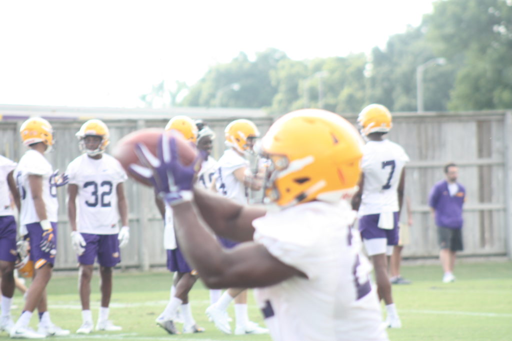 Rb Clyde Edwardsa- Belaire hauls a pass in.